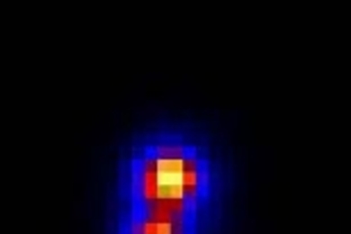 Screenshot from a movie showing early stages of the occultation of star C313.2 (smaller yellow dot) by Pluto's moon Charon.