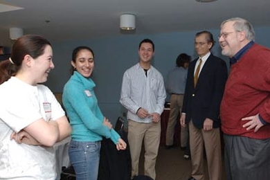 Freshmen Melissa Tanner and Julie Bharucha join sophomore Juan Prajogo, from left, in chatting with Class of 1959 alumni Alfredo Kniazzeh and David Packer at a luncheon held Tuesday, Jan. 24, in the Mezzanine Lounge of the Stratton Student Center.