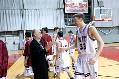 Dean for Undergraduate Research J. Kim Vandiver greets MIT basketball player Willard J. Johnson '09 as he comes off the court on Tuesday, Jan. 24. Vandiver is the team's faculty mentor.