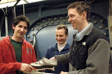 Seniors David Walfisch, left, and Kieran Culligan recently tested out a skate design that features a slider on a pivoting blade. Their advisor Kim Blair, director of the MIT Center for Sports Innovation, is at center.