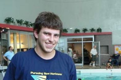 Max Mitchell of Las Vegas holds his team's entry in the underwater robot competition held in the Alumni Pool on July 28, the finale of this year's MITES program. His team, Los Pepos, won the underwater Quidditch match, but not the overall robot competition. <a onclick="MM_openBrWindow('mites1-enlarged.html','','width=509, height=583')">
<span onmouseover="this.className='cursorChange';">Open imag...