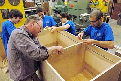 Members of the MIT Hobby Shop work on a storage unit for the Project Hope shelter in Boston. From left  to right are junior Ilan Moyer, Hobby Shop Director Kenneth Stone, junior Folkers Rojas, sophomore Alexis Dale and junior Dayan Paez.