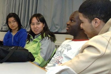 MIT students discuss issues of race and tolerance while making plans for a creative installation in honor of Martin Luther King Jr. From left are sophomore Poting Cheung, juniors Jenny Man and Christopher Chapman and sophomore Ricky Burgess.