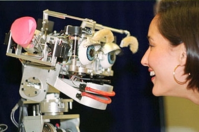 Cynthia Breazeal, MIT Media Lab, faces Kismet, a robot that mimics emotion. This photo is from 2000. <a onclick="MM_openBrWindow('coveney-kismet-enlarged.html','','width=509, height=583')">
<span onmouseover="this.className='cursorChange';">Open image gallery</span>
</a>
<noscript> <a href="coveney-kismet-enlarged.html">
<em>(no JavaScript)</em>
</a>
</noscript>
