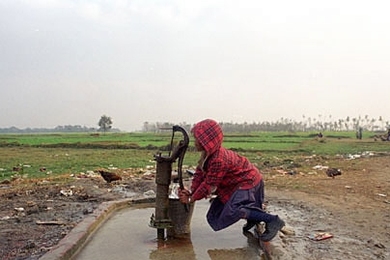 A team of eight MIT students and their advisor, Susan Murcott, brought their ingenuity and technical skills to villages in Nepal in 2002 to try to solve a very basic practical problem--the need for clean drinking water at very low cost. Here, a young girl pumps water from a well outside Lumbini, Nepal.
 <a onclick="MM_openBrWindow('nepal-girl-well-enlarged.html','','width=509, height=583')">
<sp...