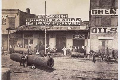 Theodore Lilienthal's photos, examined in a new book by MIT's Gary Van Zante, presented post-war New Orleans businesses as good investment opportunities, bustling yet orderly. Pictured here is the Drummond &amp; Doig Foundry. <a onclick="MM_openBrWindow('nola-boiler-enlarged.html','','width=509, height=583')">
<span onmouseover="this.className='cursorChange';">
<strong>Open image gallery</strong...