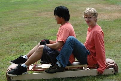 Members of the Design Squad Red Team test their prototype 'summer sled' for L.L. Bean. <a onclick="MM_openBrWindow('design-sled-enlarged.html','','width=509, height=583')">
<span onmouseover="this.className='cursorChange';">
<strong>Open image gallery</strong>
</span>
</a>
<noscript> <a href="design-sled-enlarged.html">
<em>(no JavaScript)</em>
</a>
</noscript>