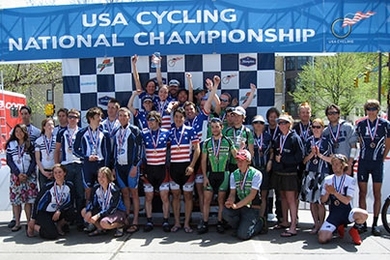 MIT Cycling's national champions celebrate in stars and stripes atop a hard-earned winner's podium.