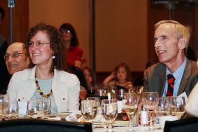 Michael Feld, right, and his wife Alison Hearn listen during a symposium held in Feld's honor on Saturday, June 27.