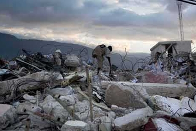 Days after the earthquake, Haitians continued to search through the rubble for any sign of life.  Petionville, Port-au-Prince.