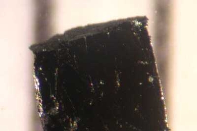 A small sample of Bismuth strontium calcium copper oxide, a cuprate superconductor. Researchers have used a offshoot of string theory to describe some of the strange behavior of this kind of material.