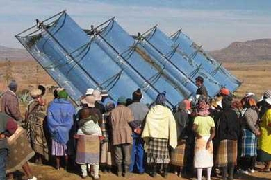Villagers in Ha Teboho, in the southern African nation of Lesotho, gather to learn about a new concentrating solar generator and hot water system installed by MIT students.