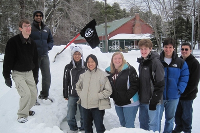 Gordon Engineering Leaders pose outside of their quinzee shelter. This is one of the team-building exercises that took place during their short course, "Project Engineering," from Jan. 27-30 at Camp Cody, N.H.