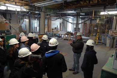 A student tour walks through the new dining facility — currently under construction — in Maseeh Hall. Maseeh will be one of five dorms in the new House Dining program.