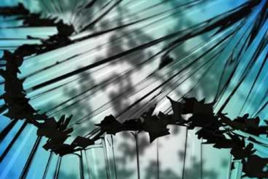 An artistic rendering of the suspension as it freezes shows graphite flakes clumping together to form a connected network (dark spiky shapes at center), as they are pushed into place by the crystals that form as the liquid hexadecane surrounding them begins to freeze.