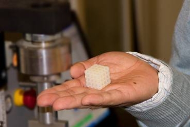 A sample of a co-continuous polymer composite material produced in the lab by a team including MIT postdoctoral researcher Lifeng Wang. Device in background is used to test the strength of the material.