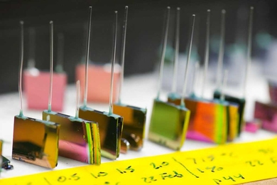 A variety of silicon chip micro-reactors developed by the MIT team. Each of these contains photonic crystals on both flat faces, with external tubes for injecting fuel and air and ejecting waste products. Inside the chip, the fuel and air react to heat up the photonic crystals. In use, these reactors would have a photovoltaic cell mounted against each face, with a tiny gap between, to convert the ...