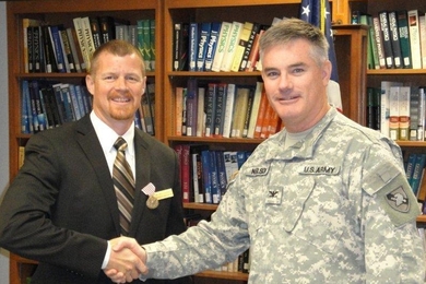 Colonel Ray Nelson, U.S. Army, (right) acting head of the Department of Physics and Nuclear Engineering at the U.S. Military Academy at West Point, presented Kenneth Chadwick with the Army's Outstanding Civilian Service Medal at a ceremony held this past June. 