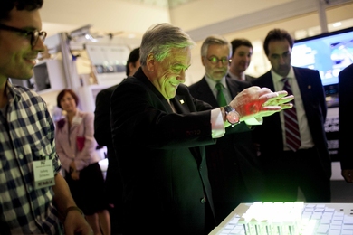 President Sebastián Piñera of Chile takes part in a demonstration of the Recompose project at the MIT Media Lab, which is a new system for manipulation of an actuated surface.