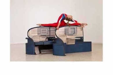 As part of the installation, gymnasts perform routines on wood replicas of business class seats from Delta and American Airlines. "We are playing with simple associations," Allora told <i>The Guardian</i> – "the relation between air travel and the way nations project themselves; the way air travel is bound up in notions of class, comfort, leisure, business. Airlines say a lot about culture and n...