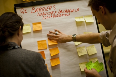 Participants in an AMP discussion group talk about university-industry partnerships.