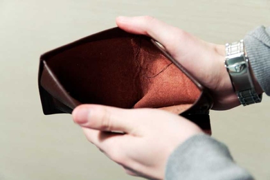 hands holding open an empty wallet