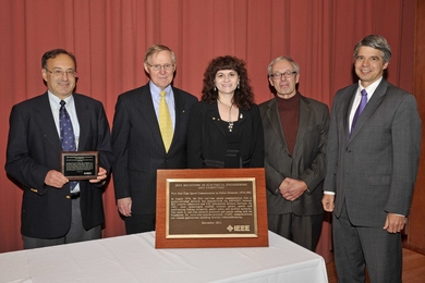 The plaque honoring 'First Real-Time Speech Communication on Packet Networks' as an IEEE Milestone in Electrical Engineering and Computing seen here is installed permanently at Lincoln Laboratory. From left to right are Dr. Clifford Weinstein, a contributor to the milestone achievement and leader of the Human Language Technology Group, Lincoln Laboratory; Dr. Peter Staecker, president-elect, IEEE;...