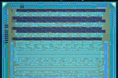 A new test chip developed by Vladimir Stojanovic, Rajeev Ram and their colleagues, which monolithically integrates electrical and optical components and was produced on an existing IBM manufacturing line.