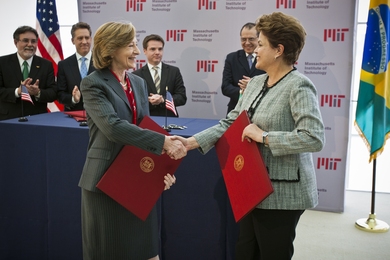 Hockfield and Rousseff shake hands after signing a letter of intent between MIT's School of Engineering and ITA, committing to work together over the next six months to evaluate the possibility of a future collaboration.