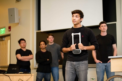 Karan Mudgal, of RISD, describes the features of the bicycle lock that he and his team designed.

From left to right: Kai Liao (Aeronautics and Astronautics), Tejas Inamdar (mechanical engineering), Cullen Johnson (LGO), Karan Mudgal (RISD), David Linders (LGO)