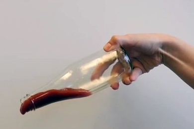 Ketchup slides out of a bottle that has the food-based, nontoxic LiquiGlide coating on the inside.