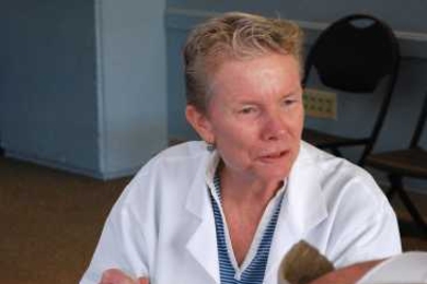 Nurse practitioner Jackie Sherry, MIT Medical’s infection control coordinator, prepares to vaccinate a patient at a flu clinic last year.