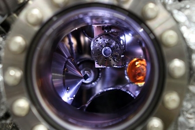 A solid-state lithium-air battery (highlighted in orange) is positioned inside a test chamber at the Advanced Light Source (ALS) at Lawrence Berkeley National Laboratory, in preparation for its testing using X-ray photoelectron microscopy.