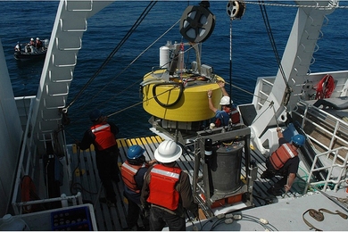 This photo shows researchers readying the robotic device connected to a buoy for its two-day sampling journey off the coast of California.