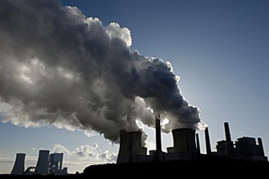 Photo of pollution coming out of two large smokestacks