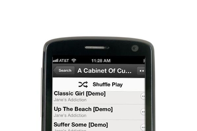 Mobile phone displaying song playlist