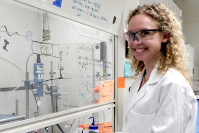 Kelsey Stoerzinger at hood where she conducts experiments on electrolytic catalysts in water-based solutions. 