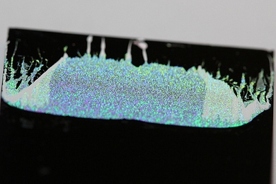 Photograph of a two-dimensional array of microspheres adhered to a substrate