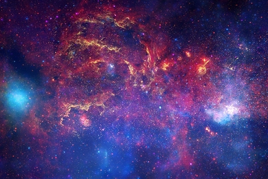 This composite image combines observations using infrared light and X-ray light that see through the obscuring dust and reveal the intense activity near the galactic core.
