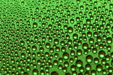 On typical hydrophobic coatings, droplets forming from high-temperature steam soon spread out to coat the surface, quickly degrading their performance. The new coating, seen here, maintains its ability to foster droplet formation over long periods.

