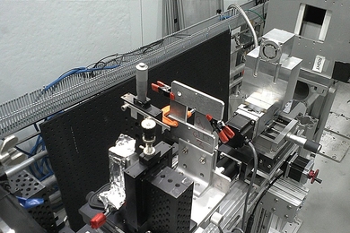 The team's small prototype neutron microscope is shown set up for initial testing at Oak Ridge National Laboratory. The microscope mirrors are inside the small metal box at top right.