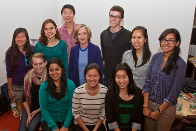 SuperUROP students gather with Susan Hockfield for a group photo. From left (seated): Christy Swartz, Harshini Jayarama, Qui Nguyen, and Michelle Chen; (standing): Angela Zhang, Chelsea Finn, Susan Hockfield, Jennifer Liu and Anvisha Pai; (back row): Francis Chen and Benoit Landry.
