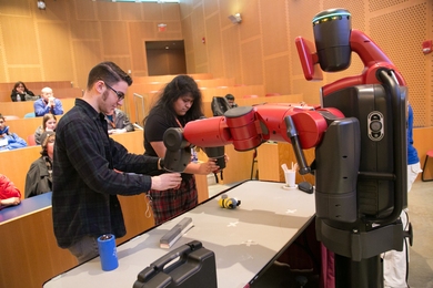 Students get hands-on with one of CSAIL's Baxter robots.