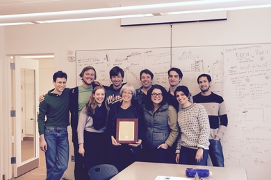 Professor Nancy Kanwisher and lab members celebrate her award.