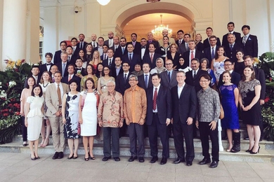 Large group of people standing in rows for photo
