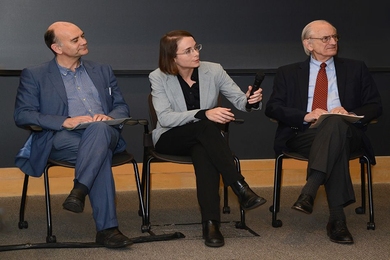 Michael Grubb (left), Valerie Karplus (center), and Henry D. Jacoby field questions from a packed audience at the MIT Tang Center.