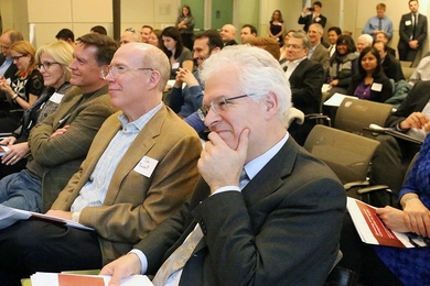 Associate Provost Richard Lester, founder and faculty director of the Industrial Performance Center, listens to discussion and report analysis of "Growing Innovative Companies to Scale: How Does Massachusetts Measure Up?" held at MIT on Thursday, Dec. 10. 