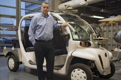 Professor Jonathan How has been selected a fellow of the American Institute of Aeronautics and Astronautics. He’s pictured here with vehicles that the Aerospace Controls Laboratory is using to investigate algorithms for predicting pedestrian motion patterns — a critical function for future mobility on demand systems and self-driving cars.