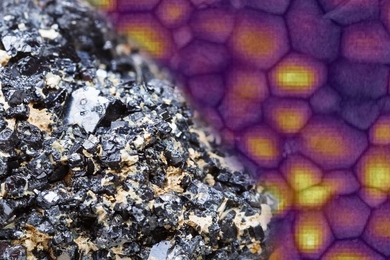 A sample of the mineral perovskite is shown in the foreground, while behind it is an image the researchers used to prove the effects of intense light on a thin film of perovskite. Fluorescence imaging shows that areas that received more light became more purified, as revealed by brighter fluorescence from those regions.
