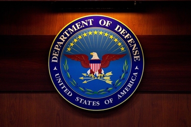 DOD seal. Center contains an eagle against a blue background. Perimeter says "Department of Defense; United States of America."